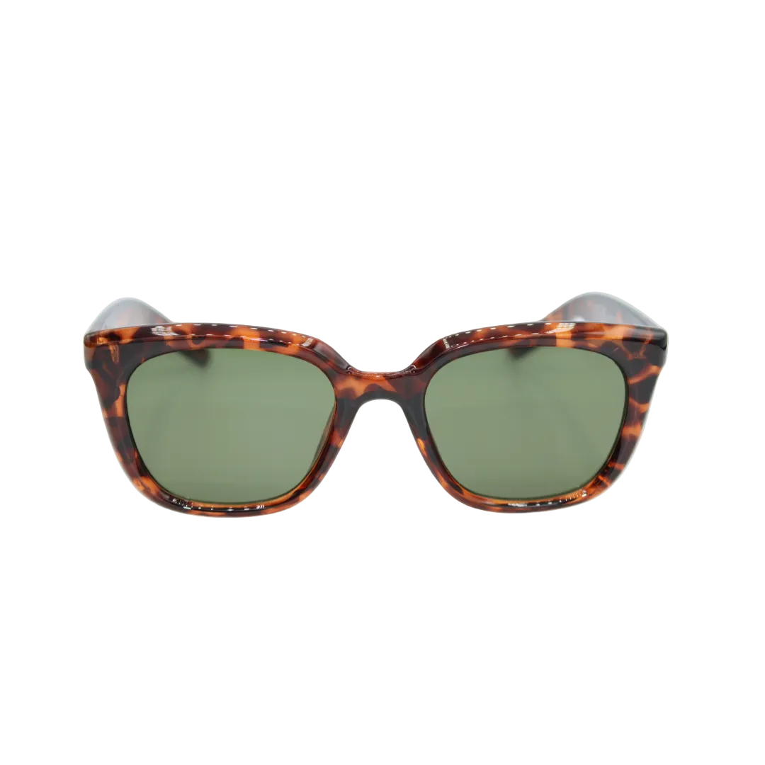 Sunglasses with tortoiseshell frame and green lenses on a white background