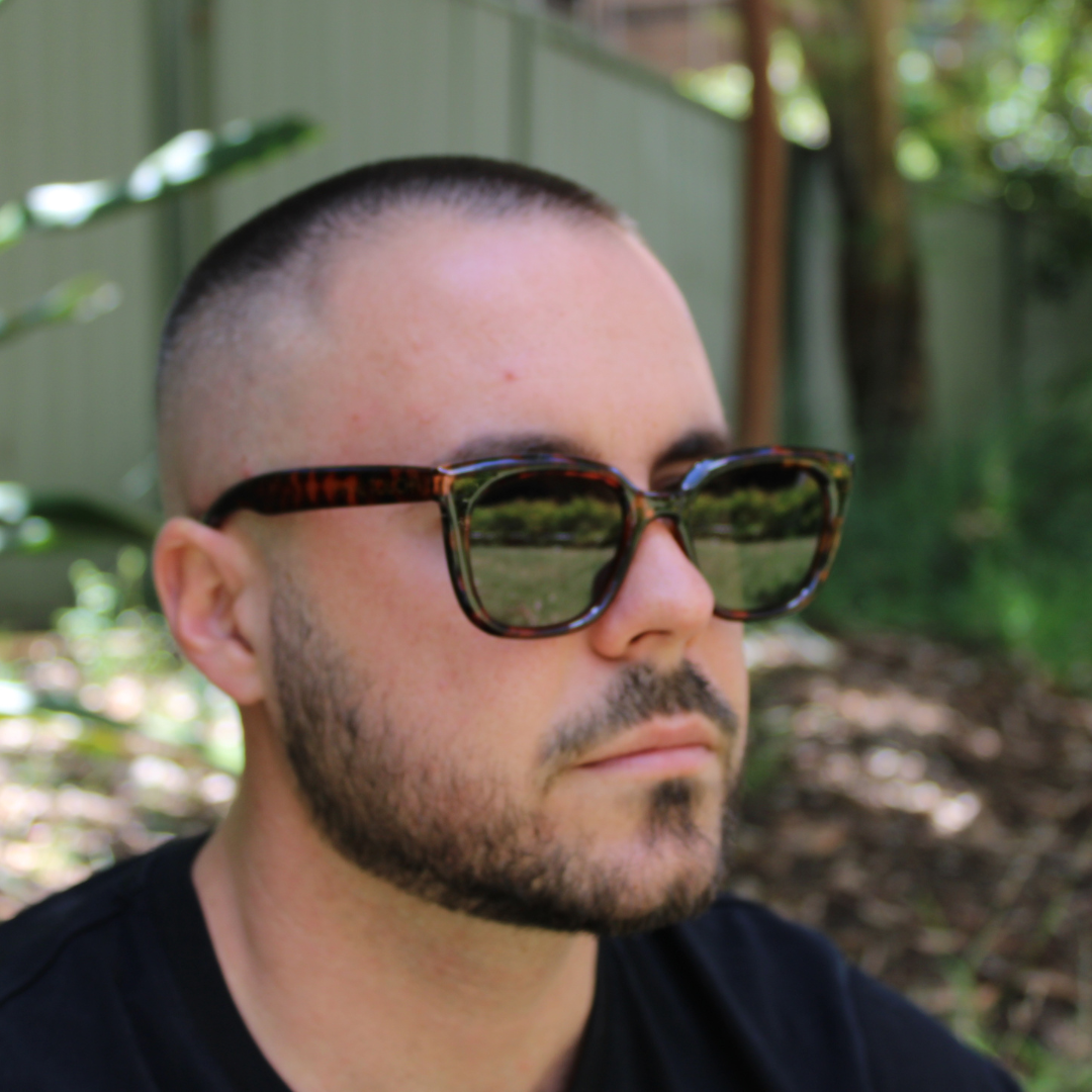 man wearing abby tortoiseshell forest green sunglasses