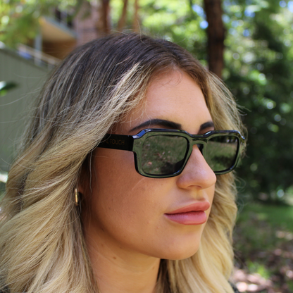 woman wearing alex black sunglasses