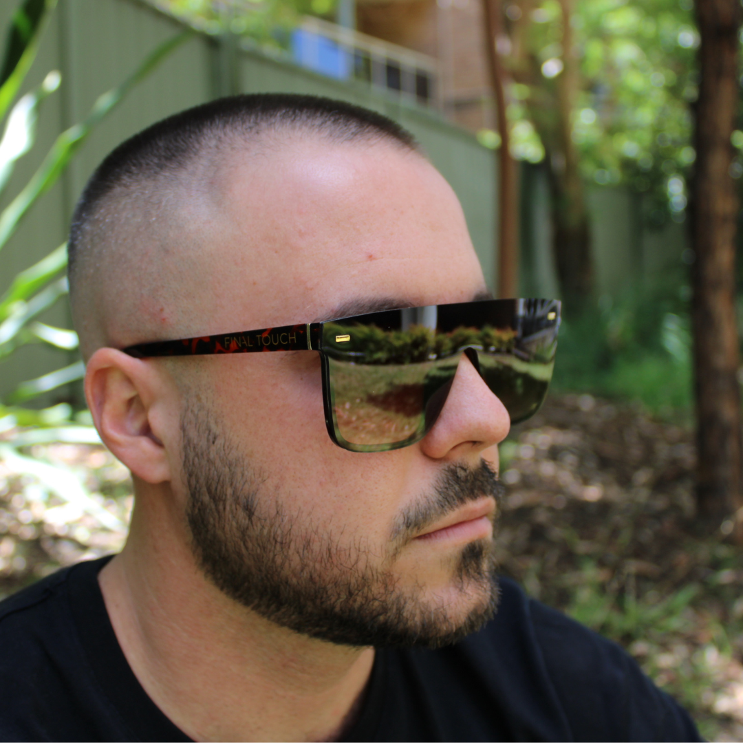 man wearing archie black amber sunglasses