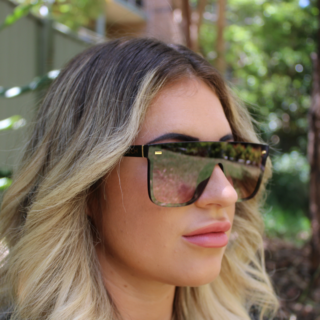 woman wearing archie black rose sunglasses