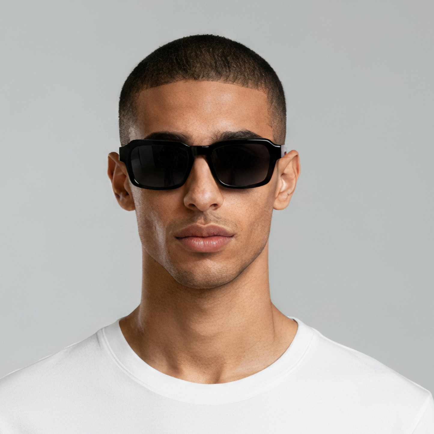 Male model styled in rectangular black sunglasses with smoke lenses UV400 – Alex by Final Touch