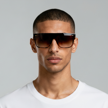 Male model styled in oversized black sunglasses with amber lenses UV400 – Archie by Final Touch