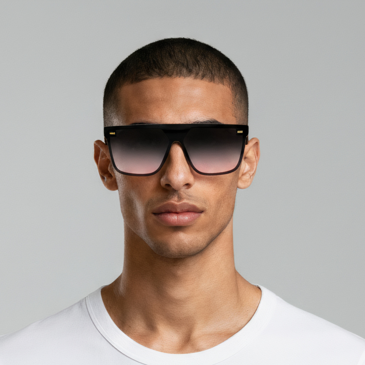 Male model styled in oversized black sunglasses with rose lenses UV400 – Archie by Final Touch