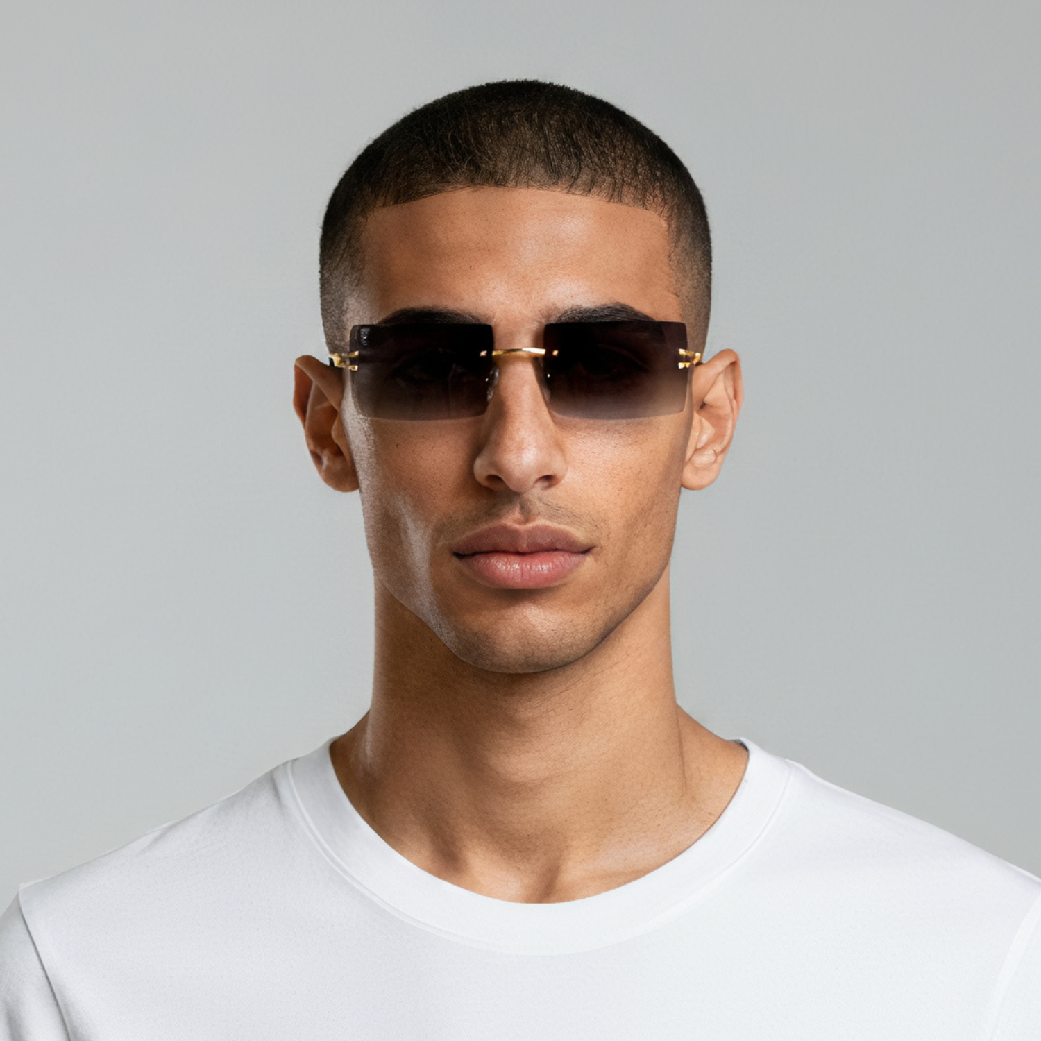 Male model styled in sunglasses with gold frame and smoke lenses UV400 – Brittany by Final Touch