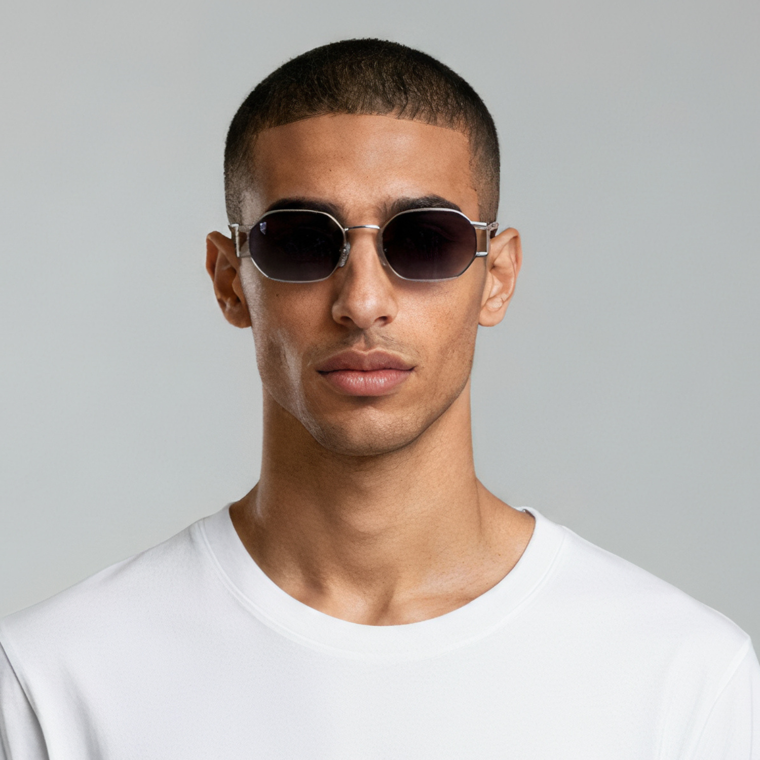 Male model styled in round silver sunglasses with grey lenses UV400 – Charlotte by Final Touch