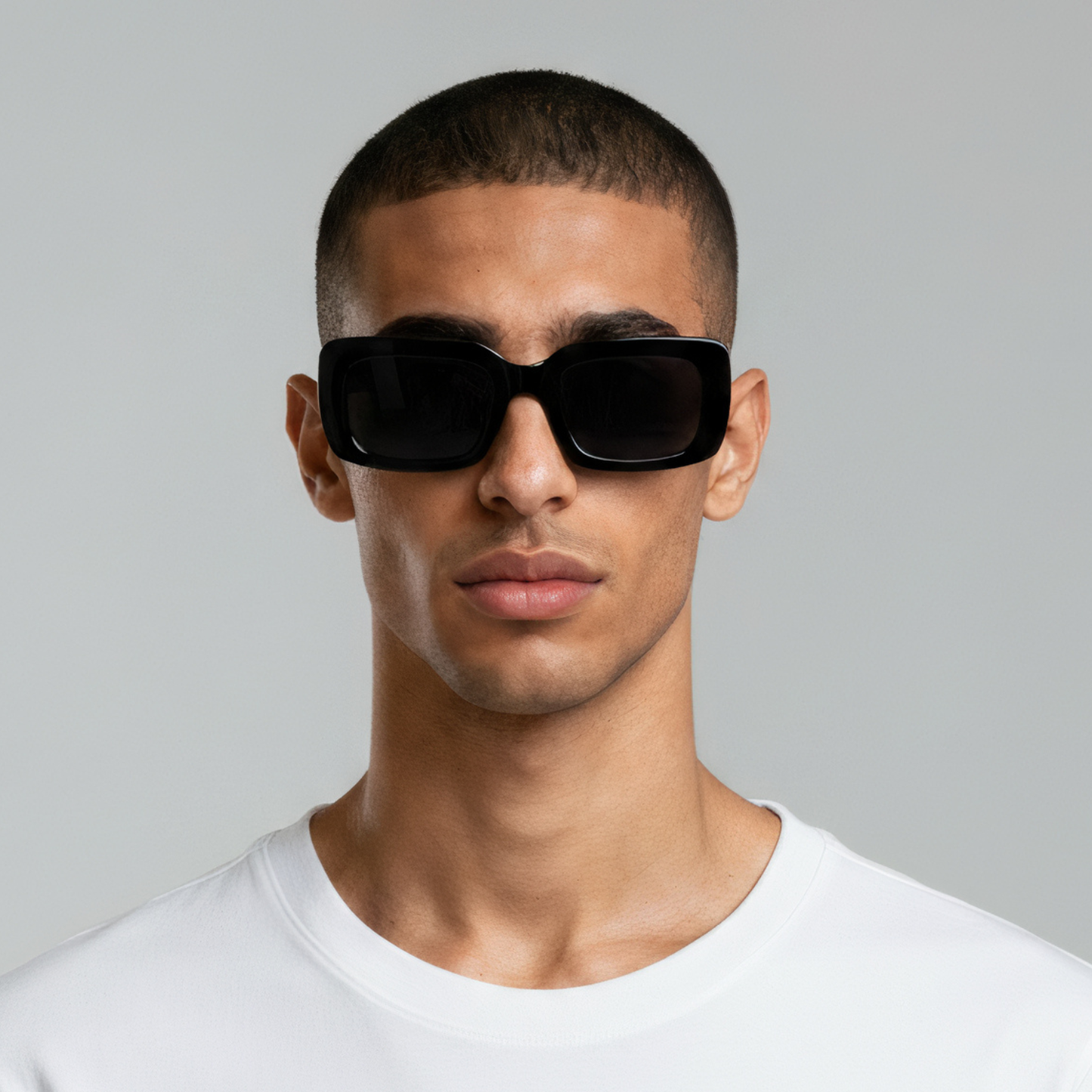 Male model styled in rectangular black sunglasses with smoke lenses UV400 – Gabby by Final Touch