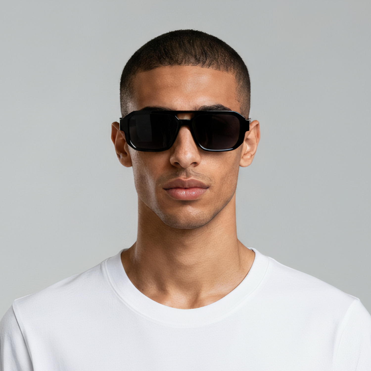 Male model styled in rectangular black sunglasses with smoke lenses UV400 – Jensen by Final Touch