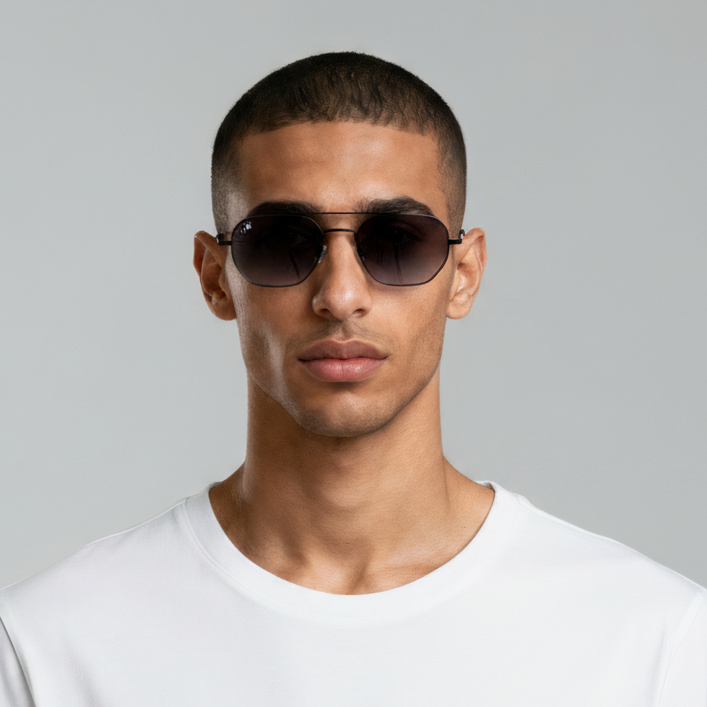 Male model styled in aviator sunglasses with matte black frame and smoke lenses UV400 – Lennon by Final Touch
