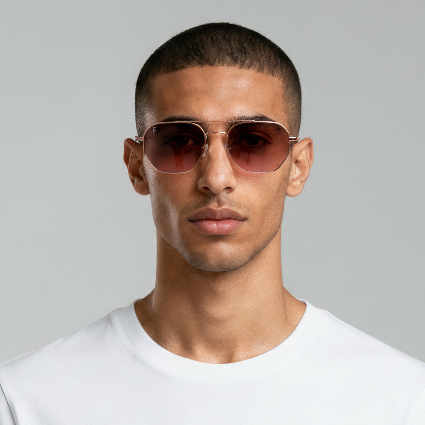 Male model styled in aviator sunglasses with rose gold frame and brown lenses UV400 – Lennon by Final Touch