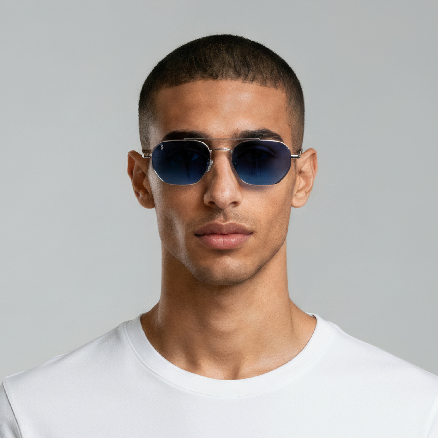Male model styled in aviator sunglasses with silver frame and blue lenses UV400 – Lennon by Final Touch