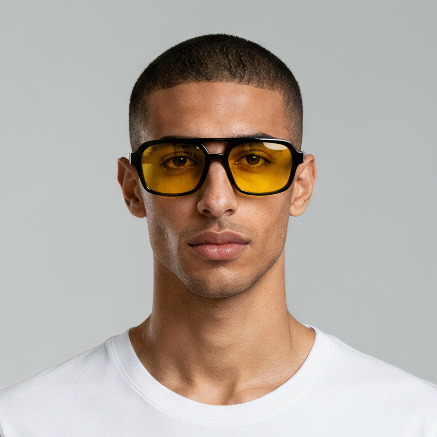 Male model styled in rectangular black sunglasses with yellow lenses UV400 – Tony by Final Touch