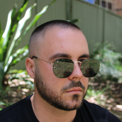 woman wearing brydan gold black sunglasses