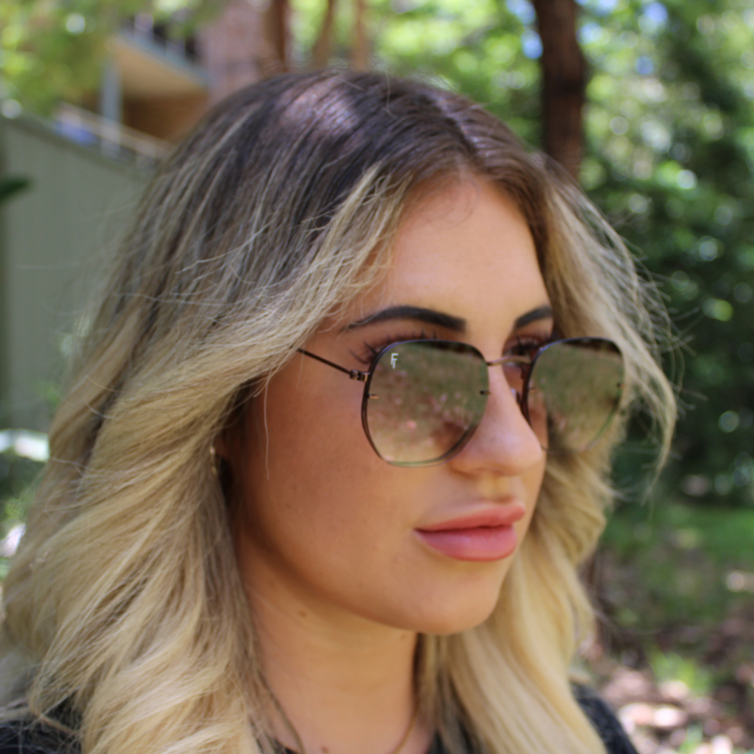 woman wearing brydan chocolate brown sunglasses