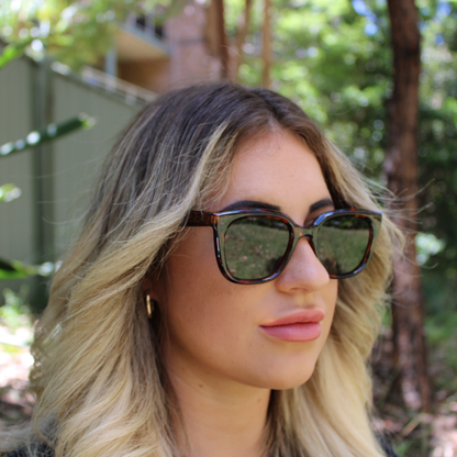 woman wearing Camila amber tortoise sunglasses