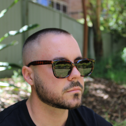 man wearing Camila amber tortoise sunglasses
