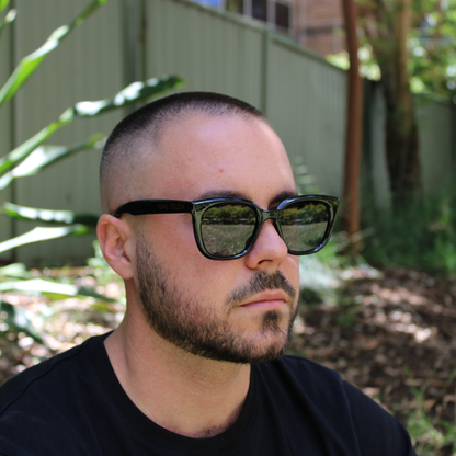 woman wearing Camila black sunglasses