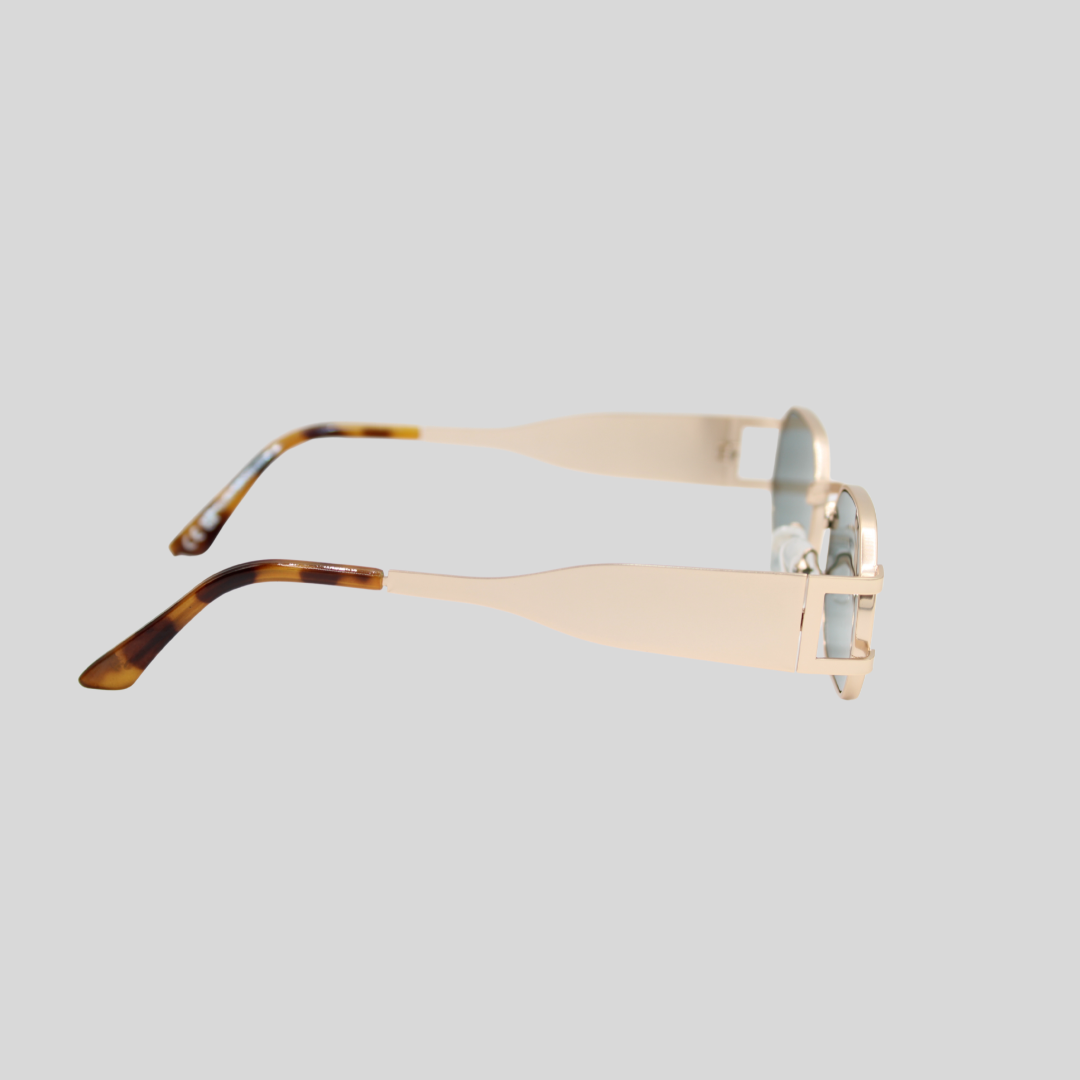 Charlotte gold forest green side with a gold frame and tortoiseshell arms on a light grey background
