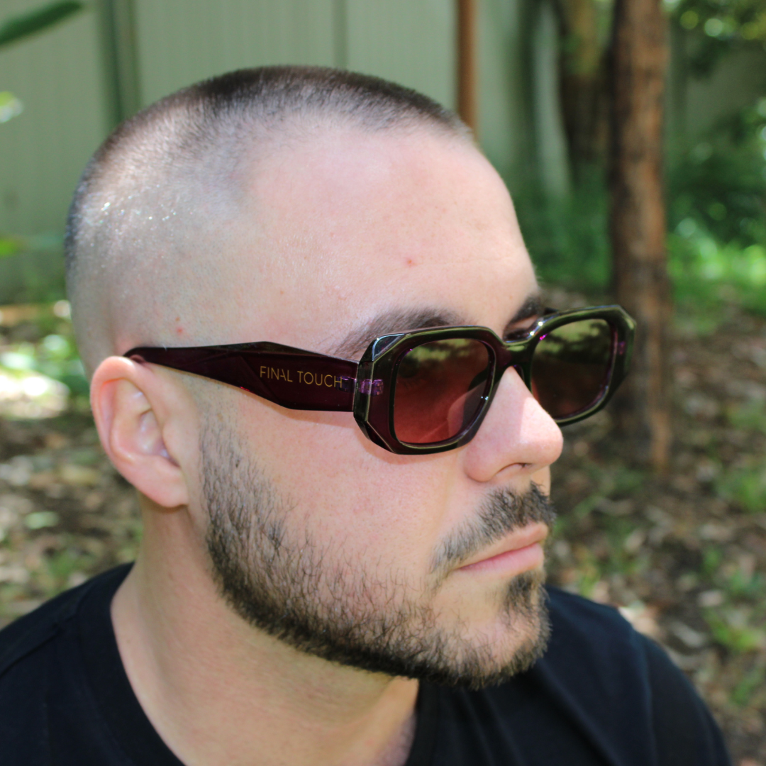 man wearing emily purple smoke sunglasses