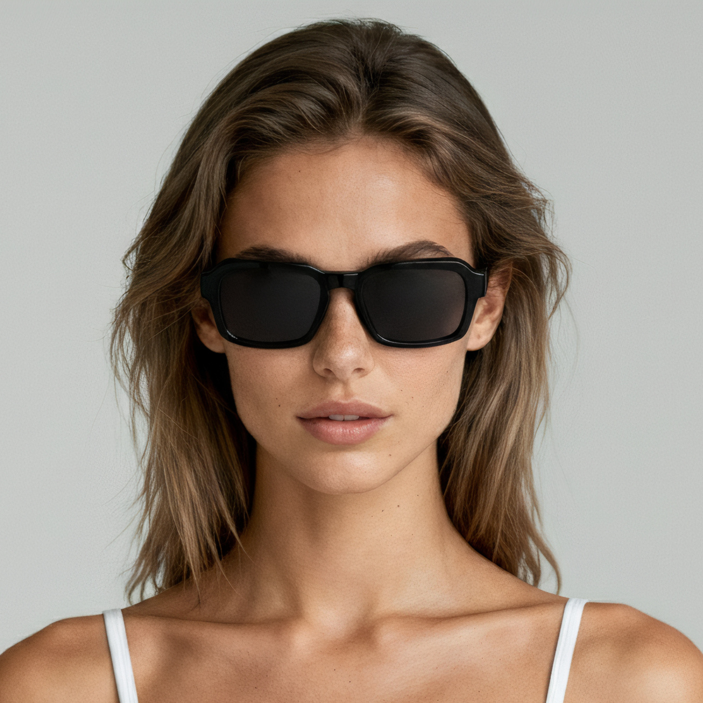Female model wearing rectangular sunglasses with black frame and smoke lenses UV400 – Alex by Final Touch