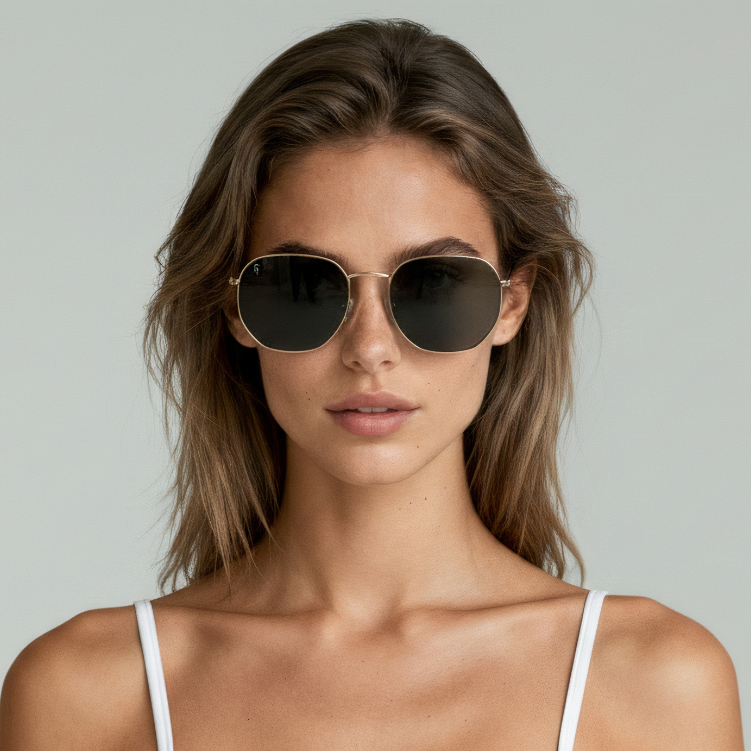 Female model wearing aviator sunglasses with gold frame and black lenses UV400 – Brydan by Final Touch