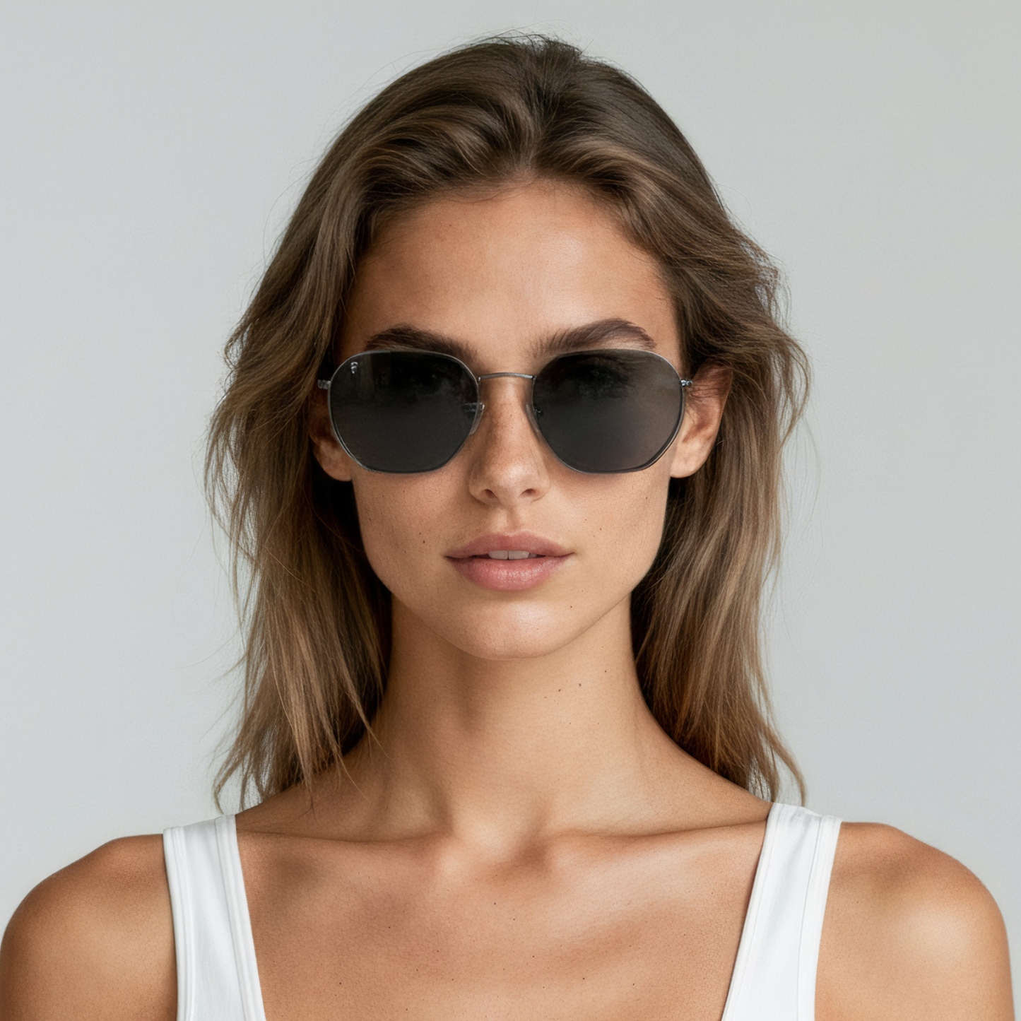 Female model wearing aviator sunglasses with black frame and smoke lenses UV400 – Brydan by Final Touch