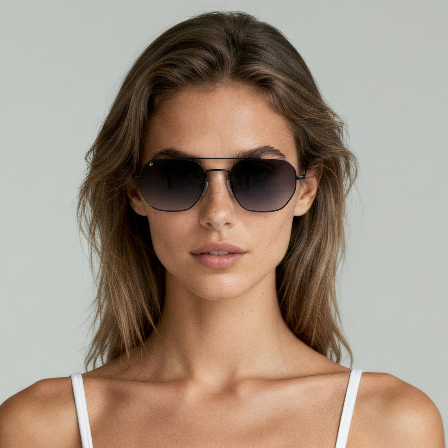 Female model wearing aviator sunglasses with matte black frame and smoke lenses UV400 – Lennon by Final Touch