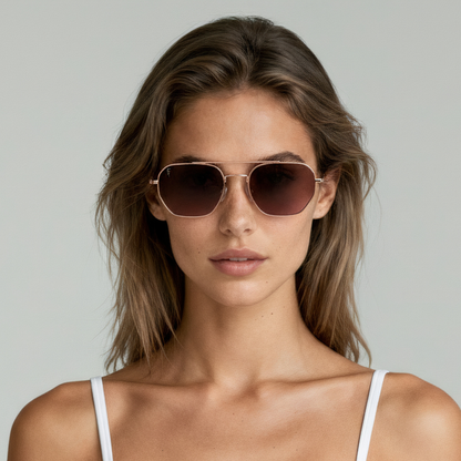 Female model wearing aviator sunglasses with rose gold frame and brown lenses UV400 – Lennon by Final Touch