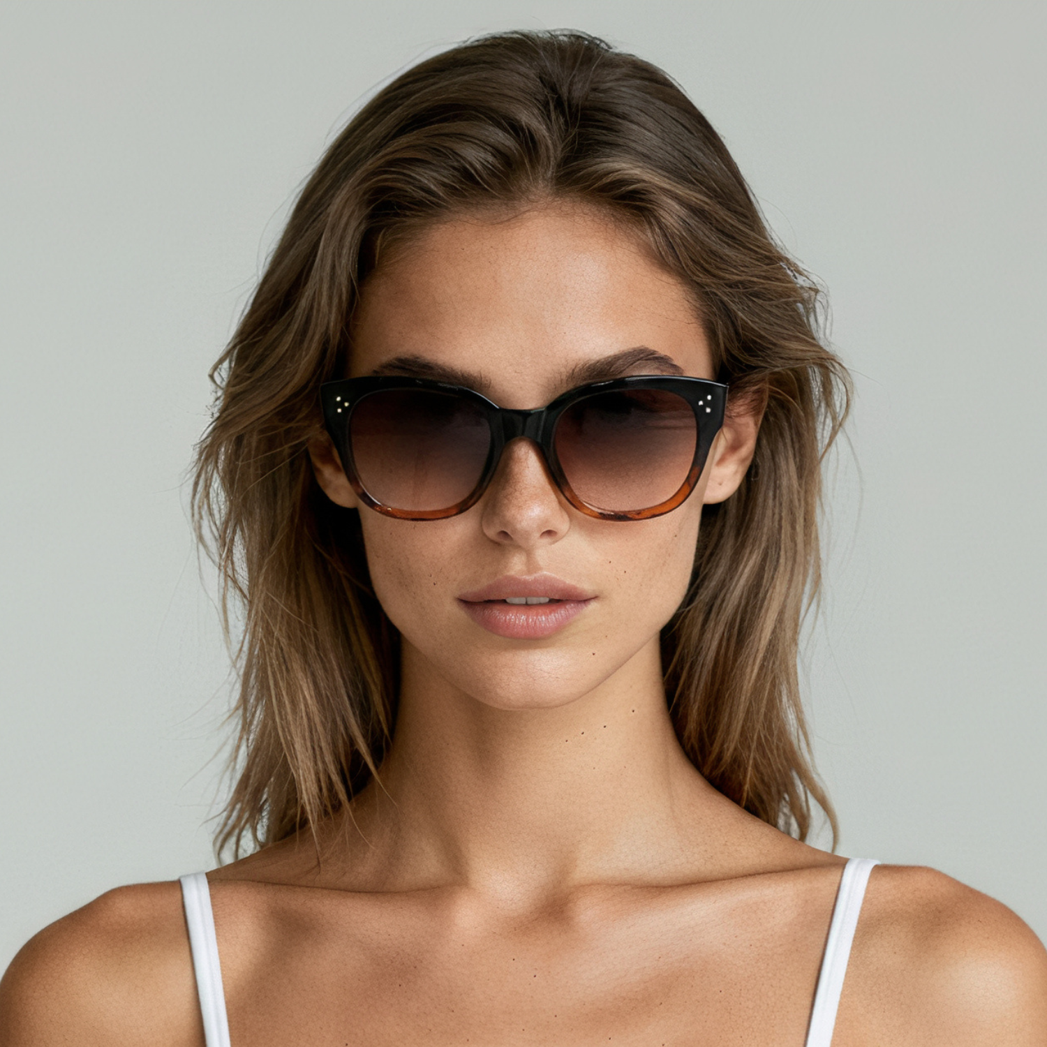 Female model wearing cat eye sunglasses with midnight amber frame and amber lenses UV400 – Nicky by Final Touch