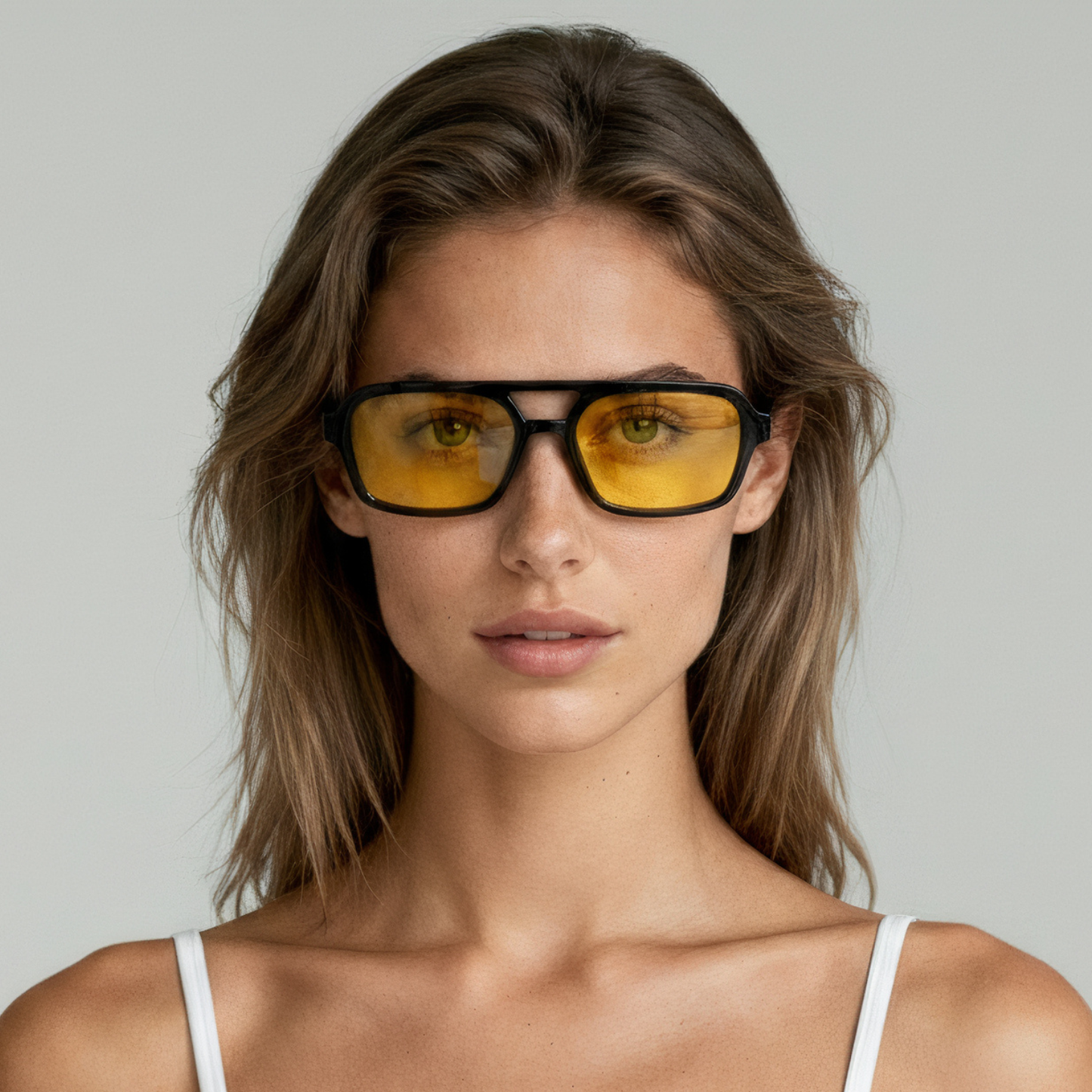 Female model wearing rectangular sunglasses with black frame and yellow lenses UV400 – Tony by Final Touch