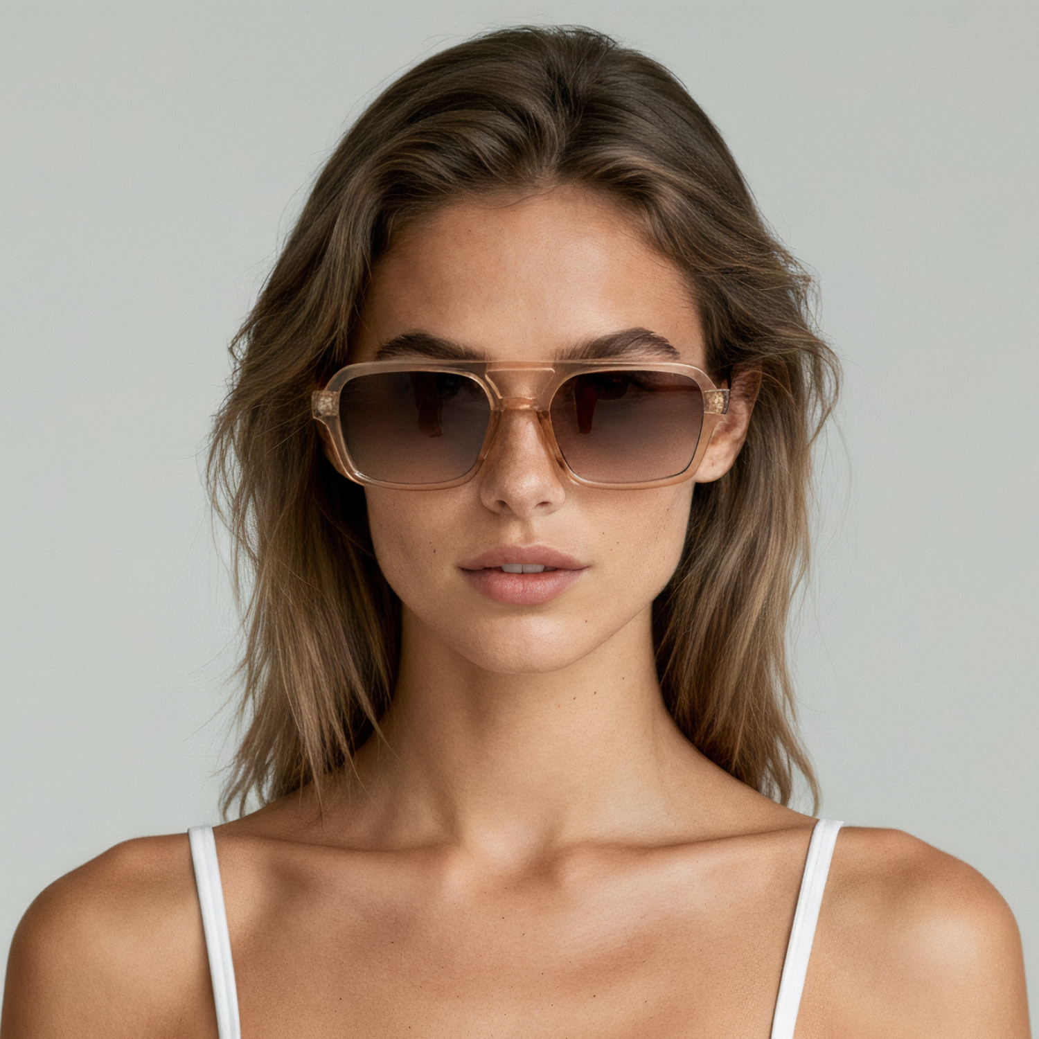 Female model wearing rectangular sunglasses with champagne frame and brown lenses UV400 – Tony by Final Touch