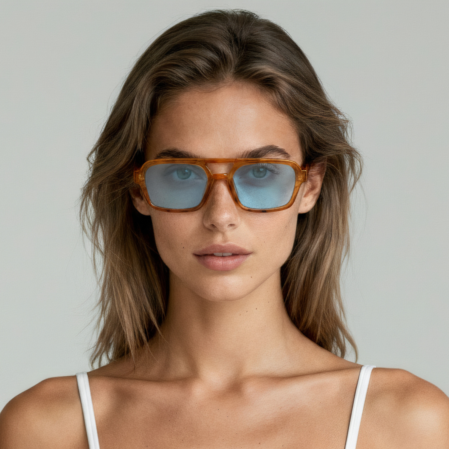 Female model wearing rectangular sunglasses with honey tortoise frame and brown lenses UV400 – Tony by Final Touch