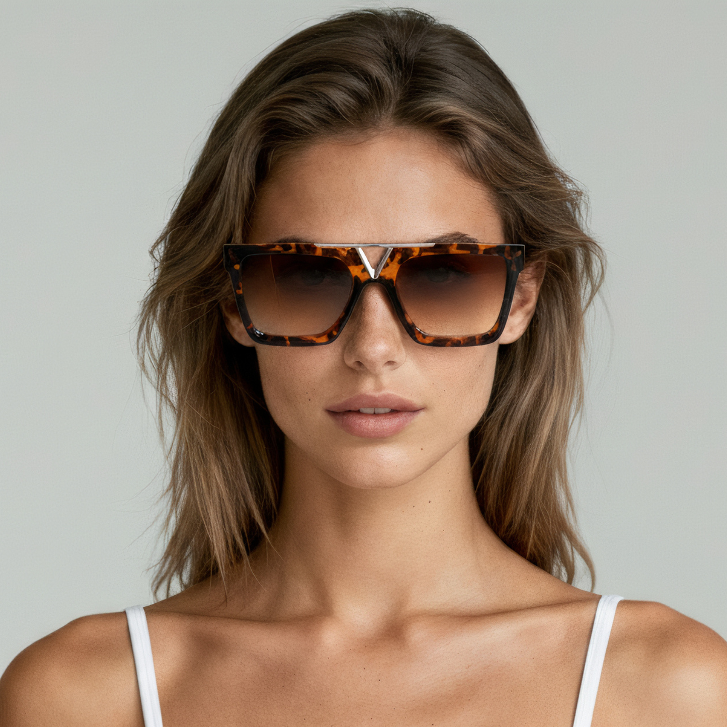 Female model wearing rectangular sunglasses with tortoise frame and brown lenses UV400 – Wade by Final Touch