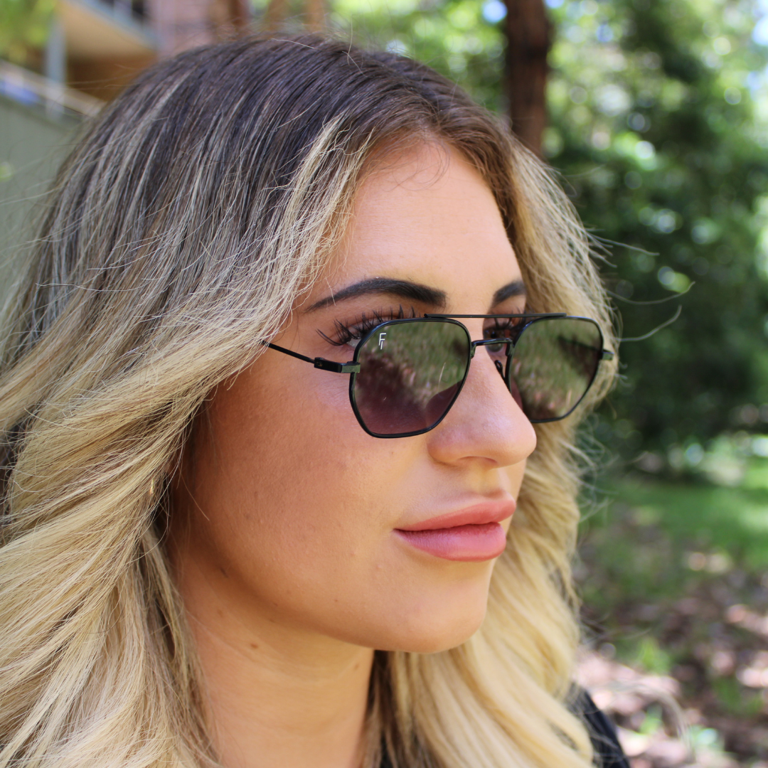 woman wearing matte black smoke sunglasses 