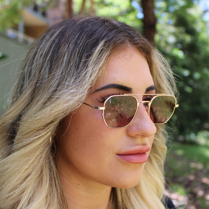 woman wearing lennon rose gold sunglasses