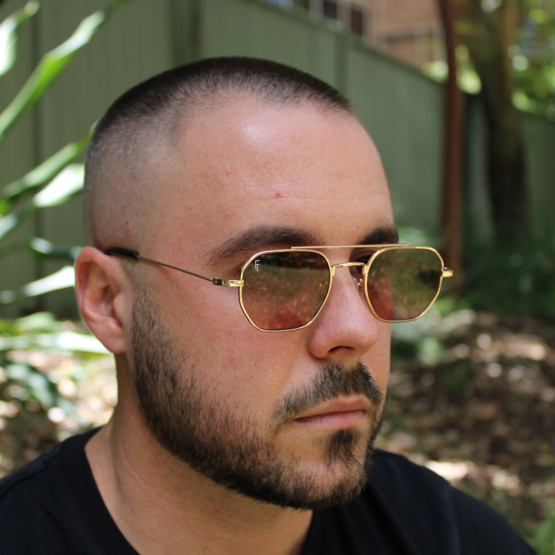 man wearing lennon rose gold sunglasses