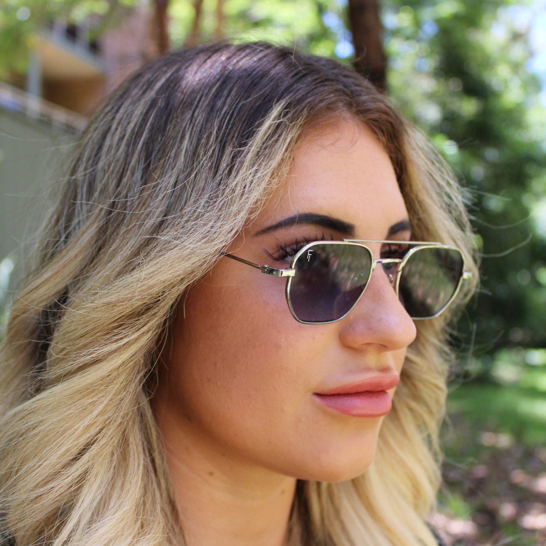 woman wearing lennon silver blue sunglasses