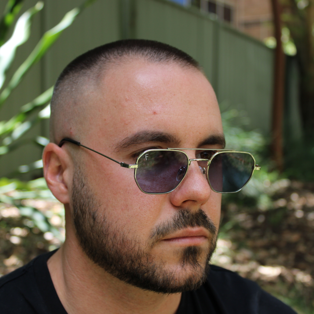 man wearing lennon silver blue sunglasses