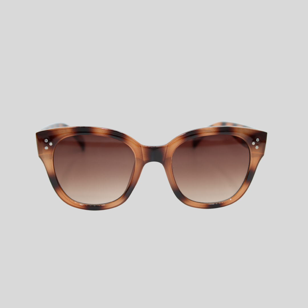 Nicky Tortoiseshell brown sunglasses with a soft square frame and brown gradient lenses on a light background.
