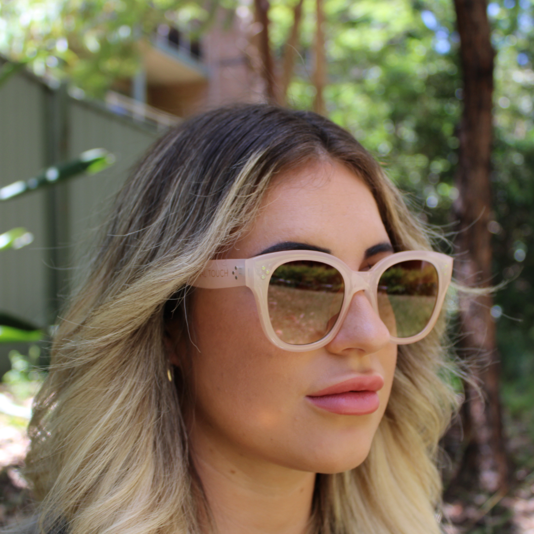 woman wearing nicky nude sunglasses