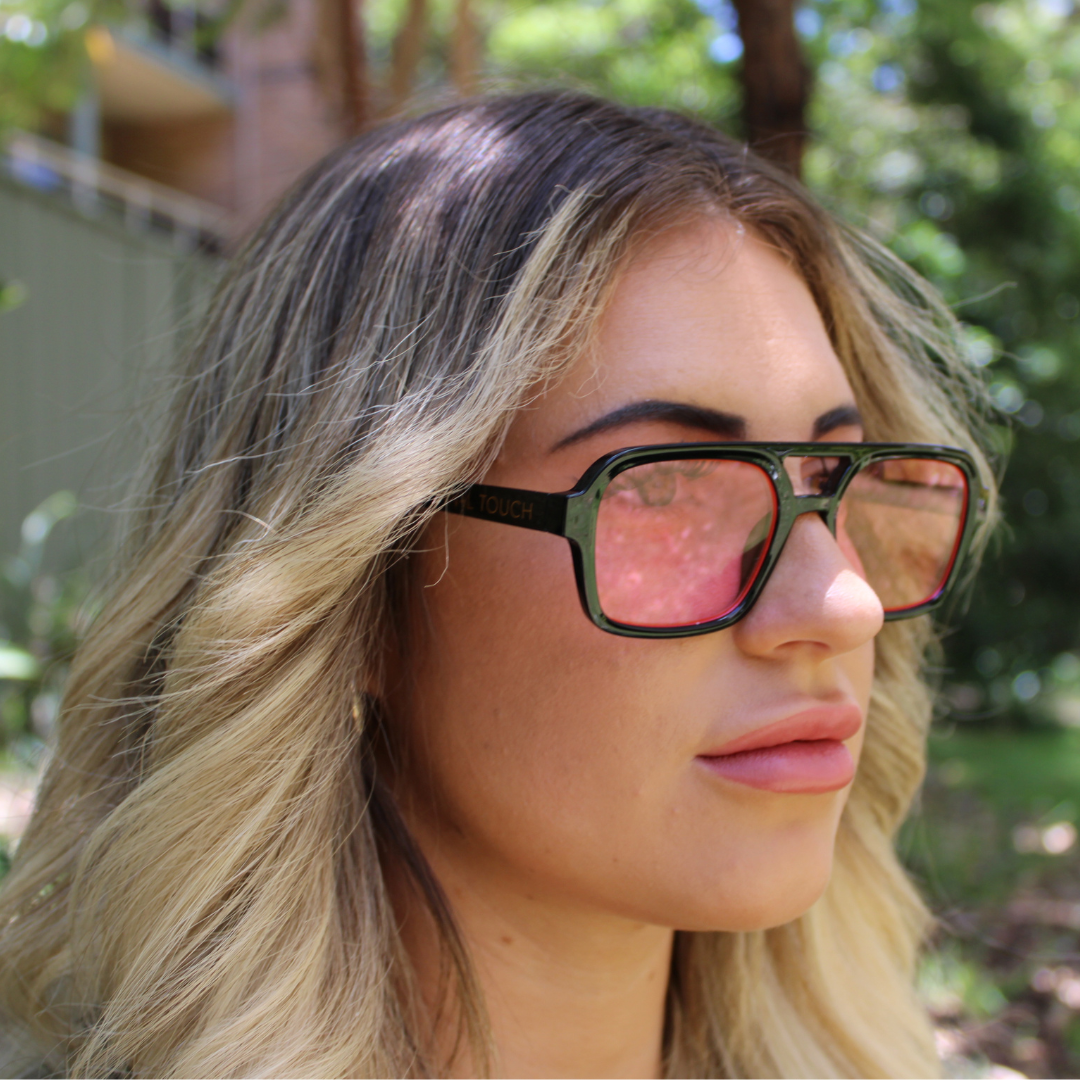 Woman wearing tony black rose sunglasses