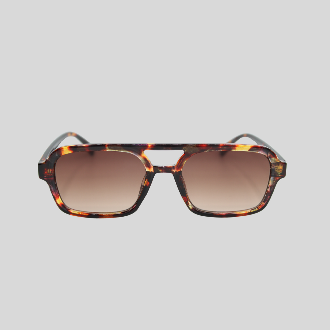 Vintage tortoiseshell square sunglasses with brown gradient lenses, front-facing on a light grey background.