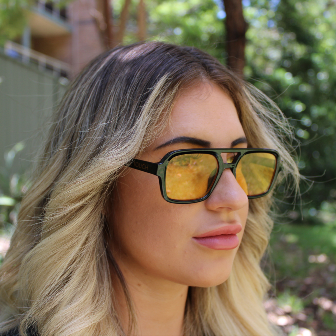 woman wearing tony black amber yellow sunglasses