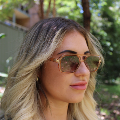 woman wearing tony champagne brown sunglasses