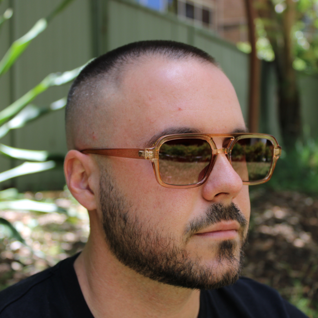 man wearing tony champagne brown sunglasses