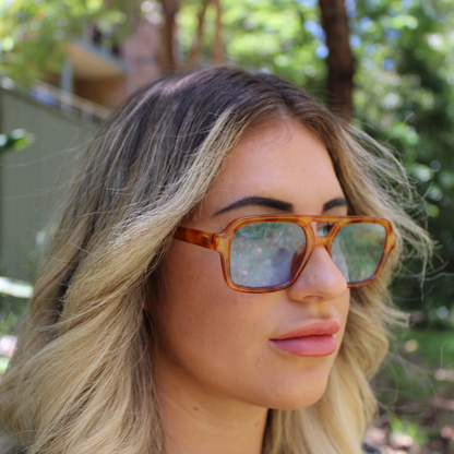 woman wearing tony honey tortoise sunglasses